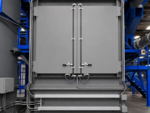 Rear access area of a slat blaster providing entry to internal components for maintenance, inspection, and servicing of the blasting system.