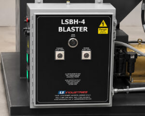 Blast timer controls and reverse blast timer controls on a fixed basket blaster used to manage blasting cycle duration and basket reversing intervals.