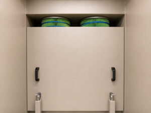 High-efficiency cartridge filters inside a powder coat booth designed to capture overspray powder and maintain clean airflow during coating operations.