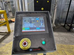 HMI/PLC touchscreen control panel used to monitor, control, and adjust industrial equipment and automated system operations.