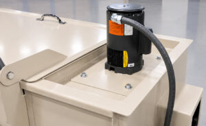 Industrial impeller motor on a hot tank cleaning system powering the circulation of heated cleaning solution throughout the tank for consistent cleaning performance.