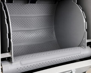 Inside view of a rubber belt blaster showing the durable rubber belt, blast zone, and abrasive blasting chamber where parts are cleaned and surface prepared.
