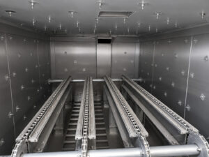 Inside view of an LS Industries Pre-Heat Oven showing the insulated heating chamber designed to deliver uniform heat around industrial parts.