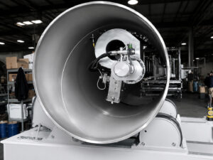 Internal blasting lance positioned inside a pipe during abrasive cleaning in an interior pipe blaster system.