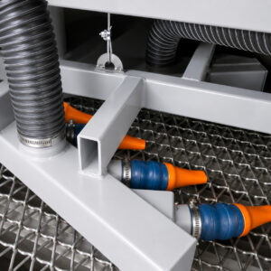 Optional stationary blow-off hoses on a concrete and scaffold blaster used to remove residual abrasive media and dust from parts after blasting.