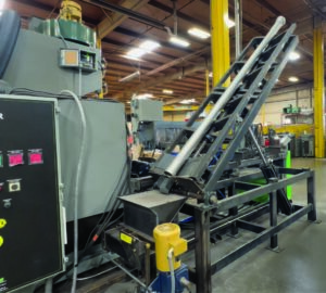 Shot removal lifter used to extract abrasive media from the inside of pipes after processing through a pipe blaster.