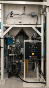 Control panel located near the blast pot in a blast room used to operate and monitor abrasive blasting functions and media delivery systems.
