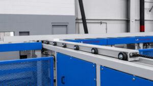 Angled view of a transfer table automation and handling system designed to move parts between production stations with precision and efficiency.