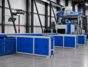Angled view of a transfer table automation and handling system designed to move parts between production stations with precision and efficiency.