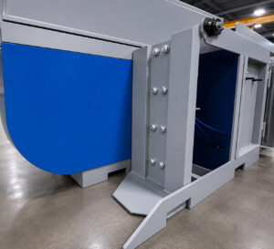 Angled view of an upender/downender automation and handling system designed to safely rotate parts between horizontal and vertical positions during production processes.