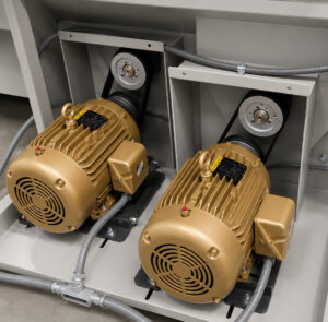 Heavy-duty impeller motors mounted on a wheel rim blaster providing power to the blast wheel system for automated cleaning and surface preparation of wheels and rims.