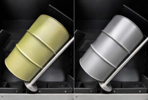Side-by-side comparison of a steel drum before and after processing through a batch drum blaster, showing the removal of rust, paint, and surface contaminants.