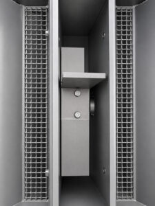 High-performance blast wheel inside a batch drum blaster used to propel abrasive media at high velocity for cleaning and surface preparation of steel drums.