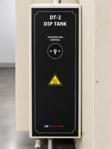 Control panel of a dip tank system featuring operator controls, temperature monitoring, timers, and system indicators used to manage immersion cleaning operations.