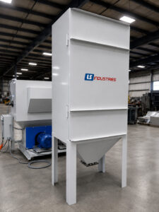 Industrial dust collector connected to a shot blaster used to capture airborne dust and maintain clean operating conditions during blasting.
