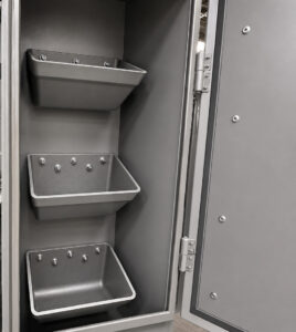 Abrasive elevator system on a table blaster that lifts recovered shot media and returns it to the blasting system for continuous operation.