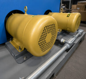 Impeller motors on a batch cylinder shot blaster used to power blast wheels for high-velocity abrasive media delivery.