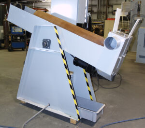 Interior cylinder blaster lifting a cylinder into position for internal abrasive blasting and surface preparation.