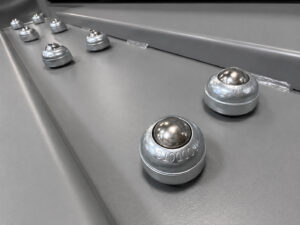 Rollers used to support and easily move cylinders into position for loading into a cylinder blaster system.