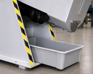 Shot drip tray beneath an Interior Cylinder Blaster designed to collect and recover abrasive media for reuse in future blasting cycles.