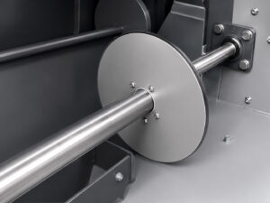 Cylinder stoppers inside a propane tank blaster used to keep tanks positioned within the optimal blasting area during processing.