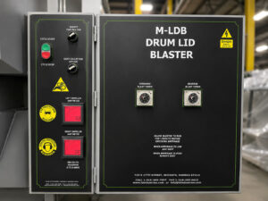 Control panel for a batch drum lid blaster featuring machine controls, operating functions, and system monitoring for automated lid blasting operations.