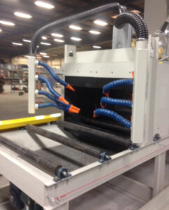 Close-up view of industrial roller conveyors used for transporting parts and materials through automated production and handling systems.