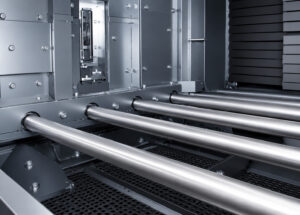 Angled view of a roller conveyor automation and handling system designed to transport parts and materials efficiently between production processes.