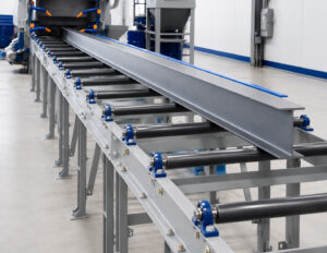 Angled view of a roller conveyor automation and handling system designed to transport parts and materials efficiently between production processes.