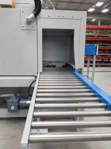 Angled view of a roller conveyor automation and handling system designed to transport parts and materials efficiently between production processes.