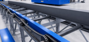 Angled view of a roller conveyor automation and handling system designed to transport parts and materials efficiently between production processes.