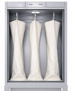 Filter bags inside a bag house style dust collector designed to capture dust, abrasive fines, and airborne contaminants from industrial processes.