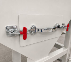 External access latches on the LS Industries Drum Lid Washer that secure the filtration compartment while allowing operators to access and remove collected debris and contaminants from the filter system.
