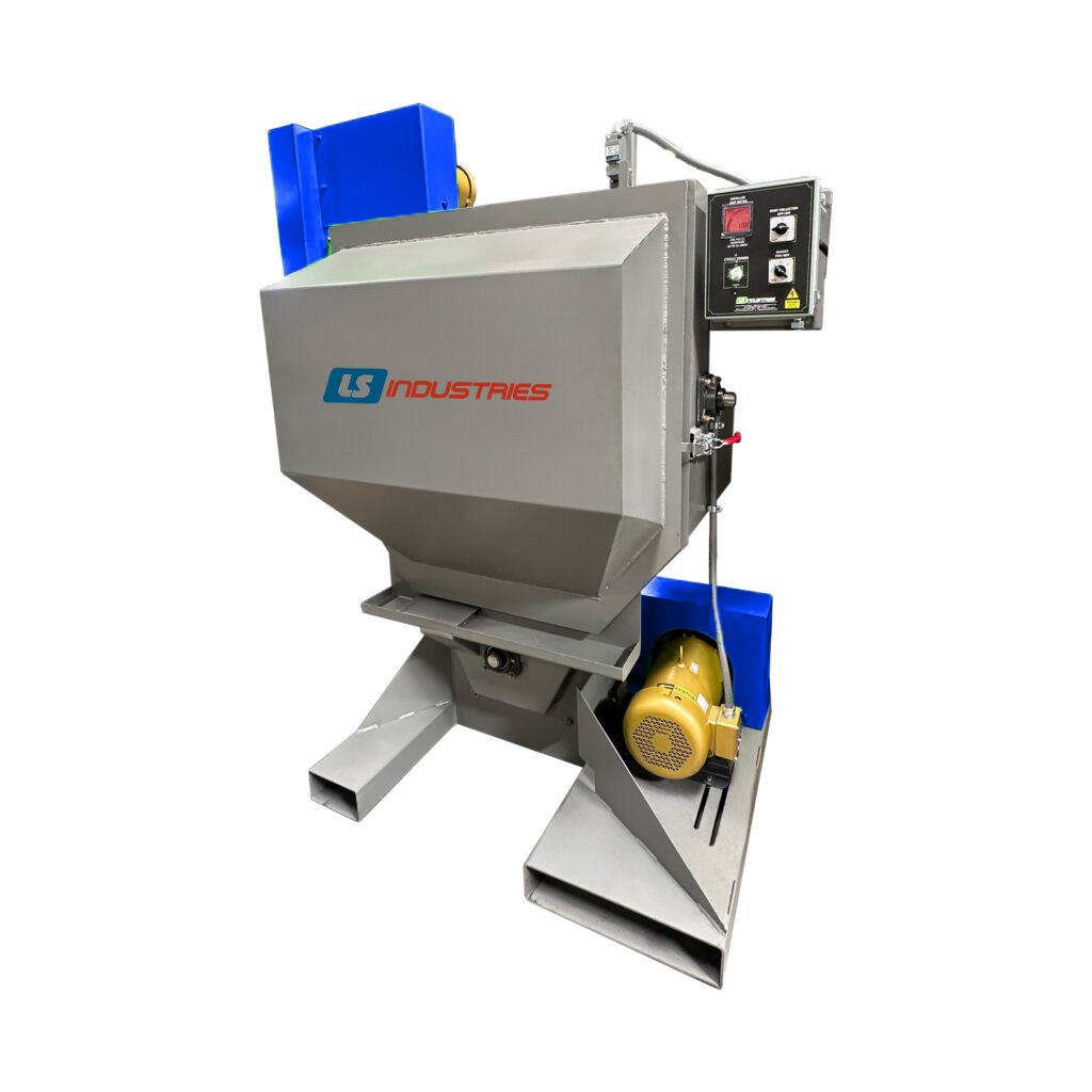 Angle view of a tumble blaster industrial machine used for batch cleaning and surface preparation of metal parts using abrasive media.