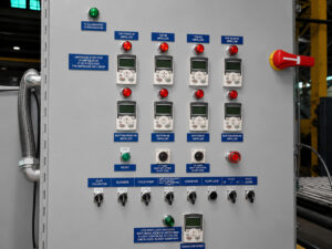 Control panel for a plate blaster featuring machine controls, system monitoring, and operating functions for automated blasting operations.