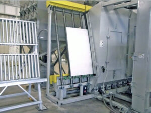 Vertical stone blaster option for a plate blaster used to enhance abrasive cleaning and surface profiling of steel plates.
